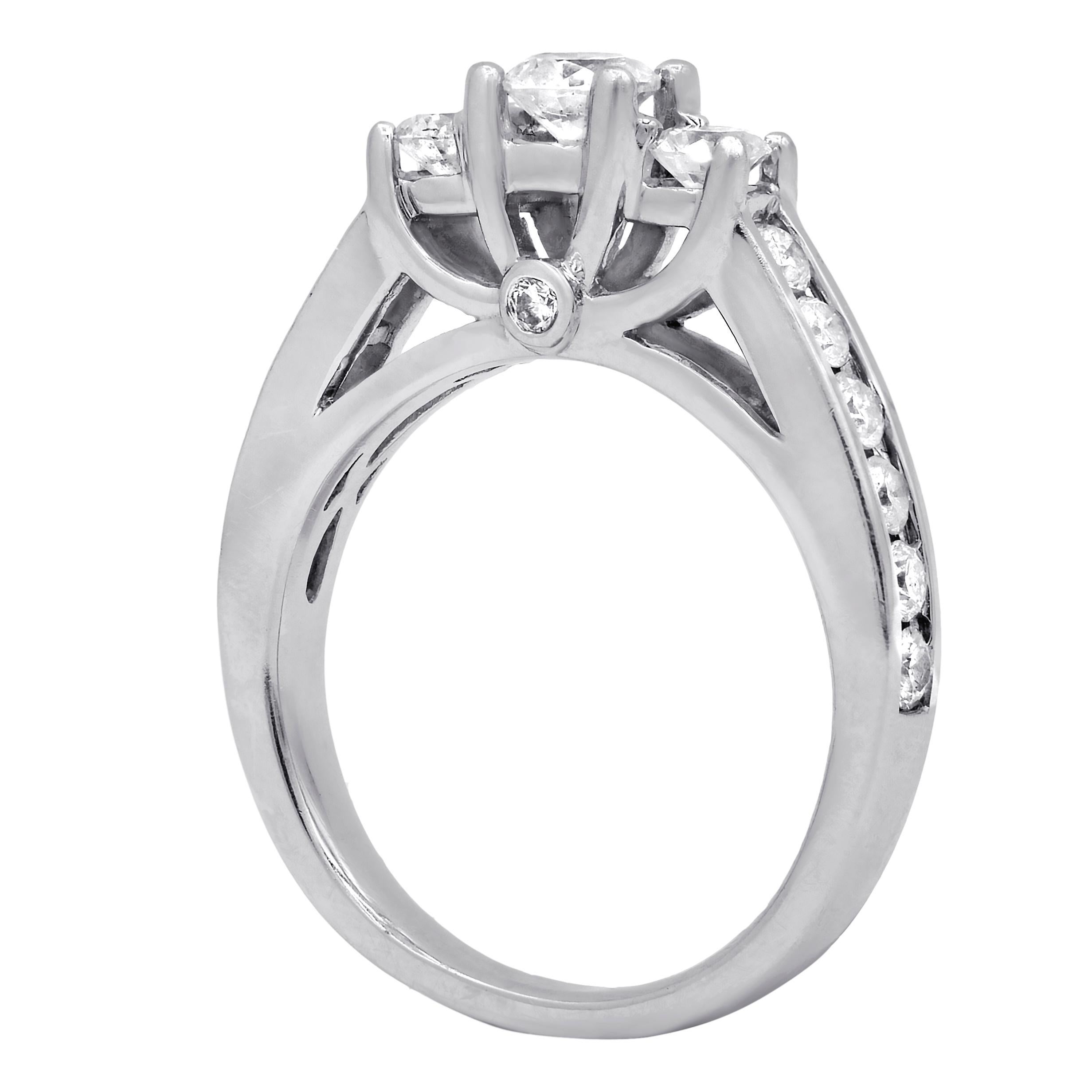 14kt white gold three diamonds engagement ring, center .45 ct round diamond set with 1.25ct of side diamonds
