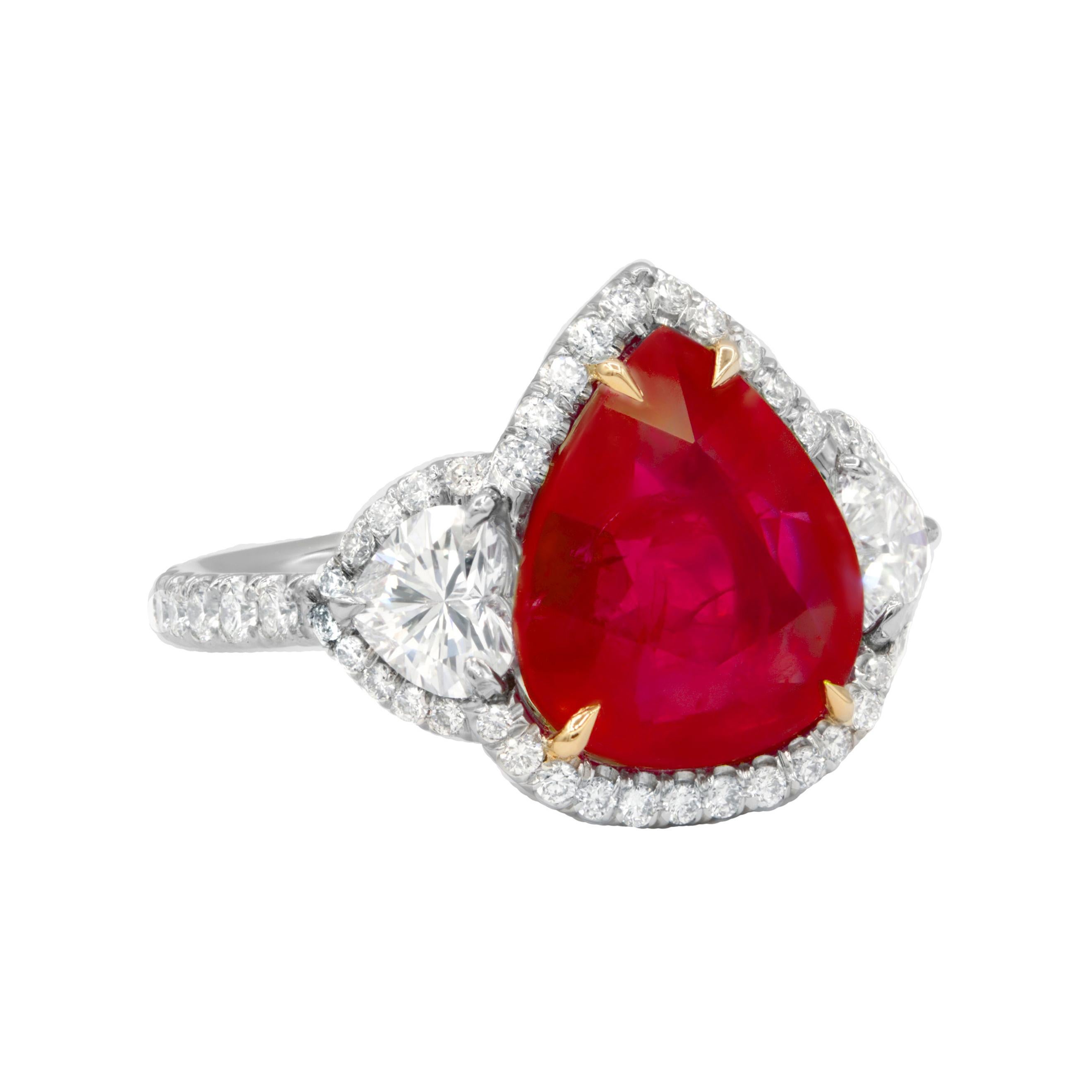 Magnificent ruby diamond ring with gia certified 6.27ct ruby set with 1.70ct of round diamonds all the way around in platinum halo and 2 hearts gia certified on the sides setting
