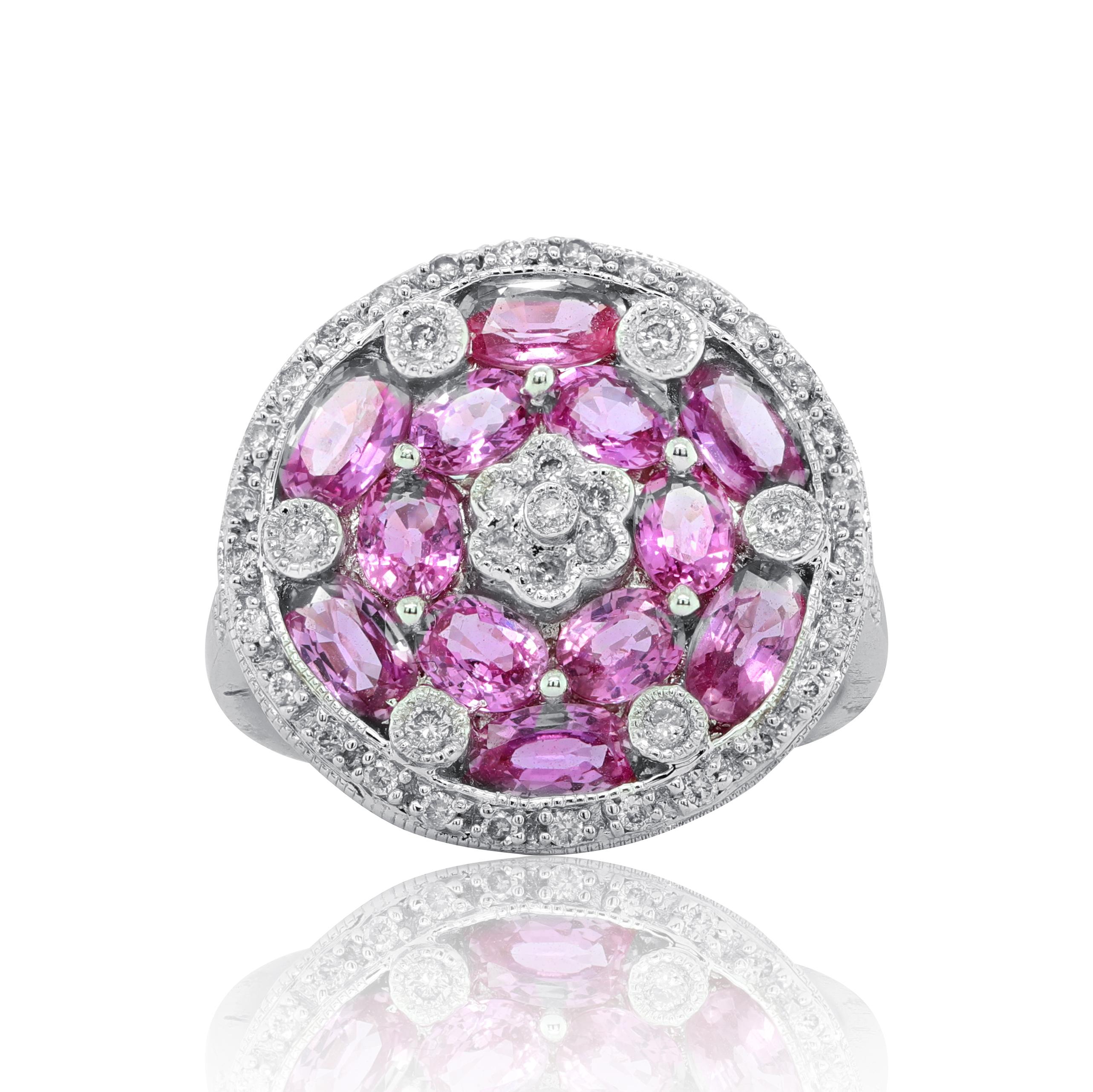 18Kt white gold sapphire ring with 2.00ct oval pink sapphires surrounded by 1.40ct micro pave diamonds.
