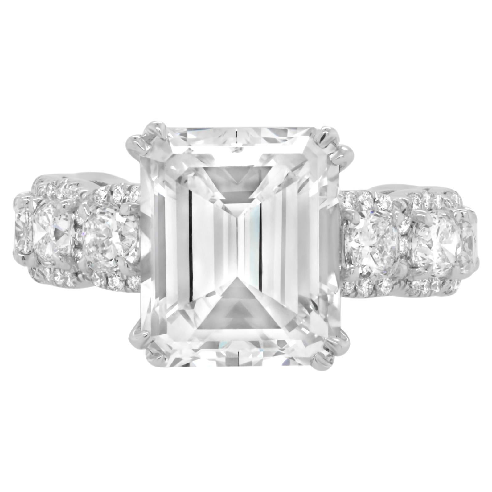 Diana M. GIA 5.04ct Emerald Cut Engagment Ring With 3.00ct Of Side Diamonds  For Sale