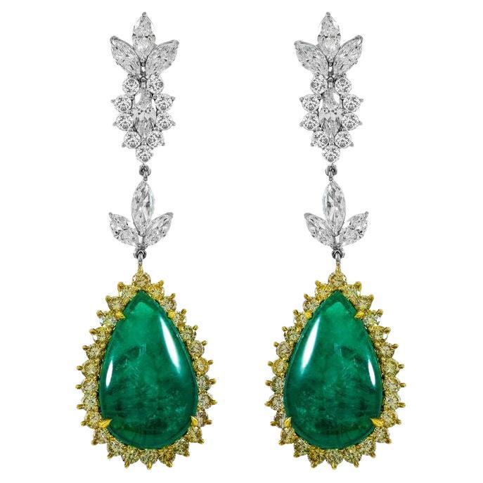 Diana M. GIA Certified 14.05 Carat Pear Shaped Emerald and Diamond Earrings For Sale