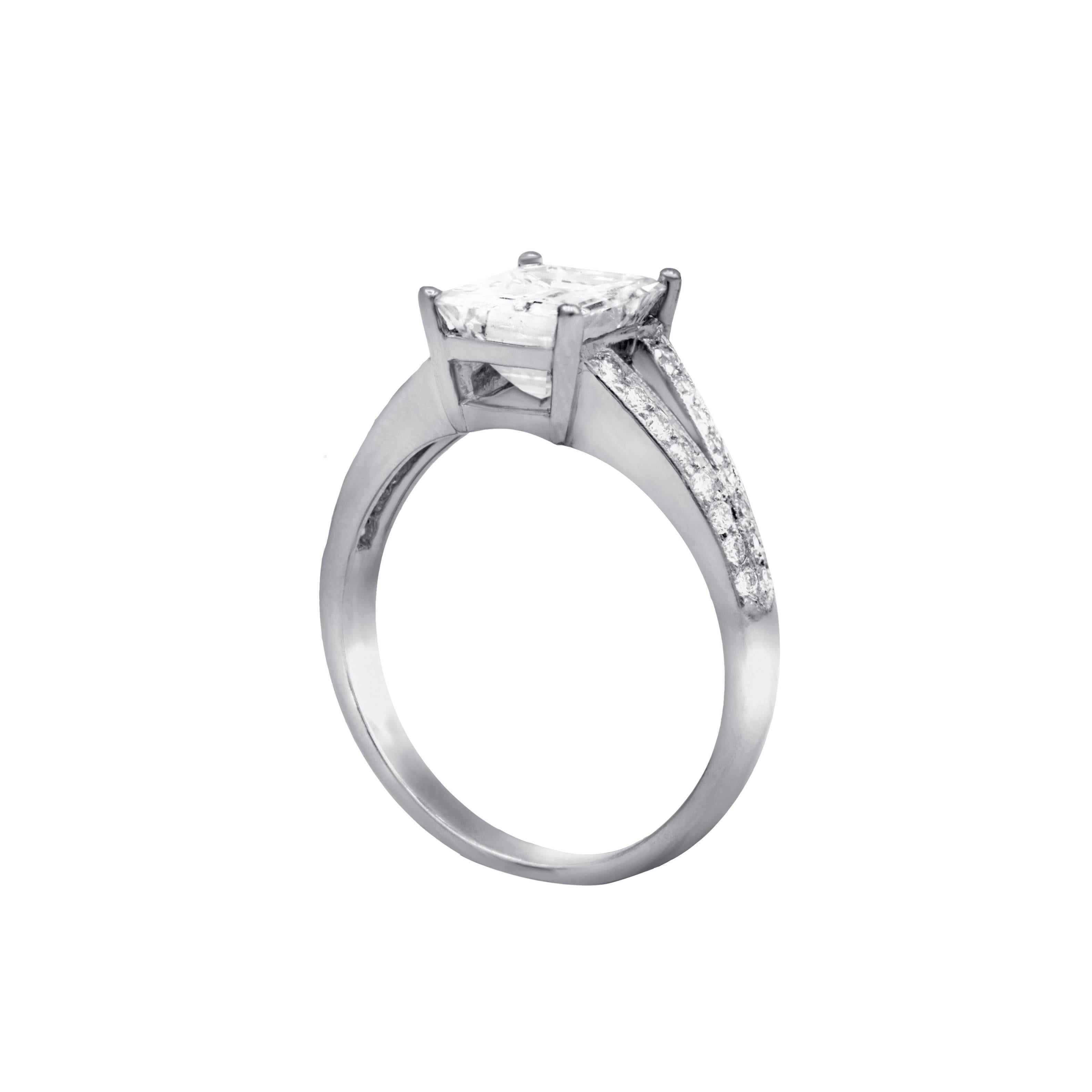 Beautiful and elegant diamond engagement ring with GIA certified emerald cut diamond in the center,weighing 1.00 cts D color/VS2 clarity set in platinum split shank mounting.Shank is adorned with additional 0.60 cts round brilliant cut diamonds.

•