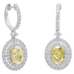 Diana M. GIA  Fancy Light Yellow Oval Diamond Earrings 3.00cts With Dauble Halo