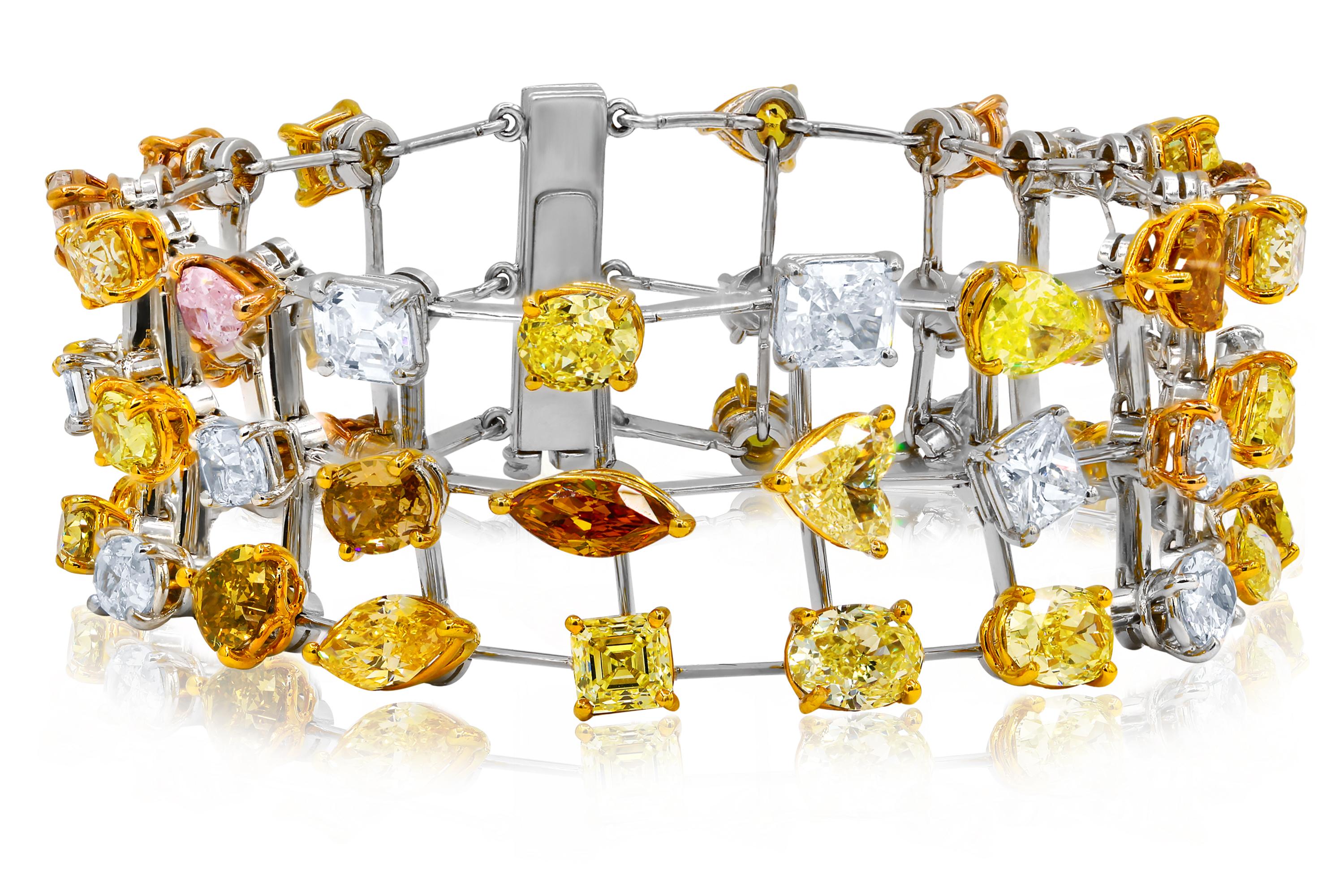 Tri-row multi colored diamond bracelet featuring multi-color and multi-shaped diamonds, totaling 38.00 carats of diamonds, mounted in platinum and 18K gold. Combination of Pink, Yellow White and Brown Diamonds. 
Diana M. is a leading supplier of