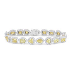 Diana M. Multi Shape 18.79 Cts Fancy Yellow Diamond Bracelet with 4.10 Cts Halo
