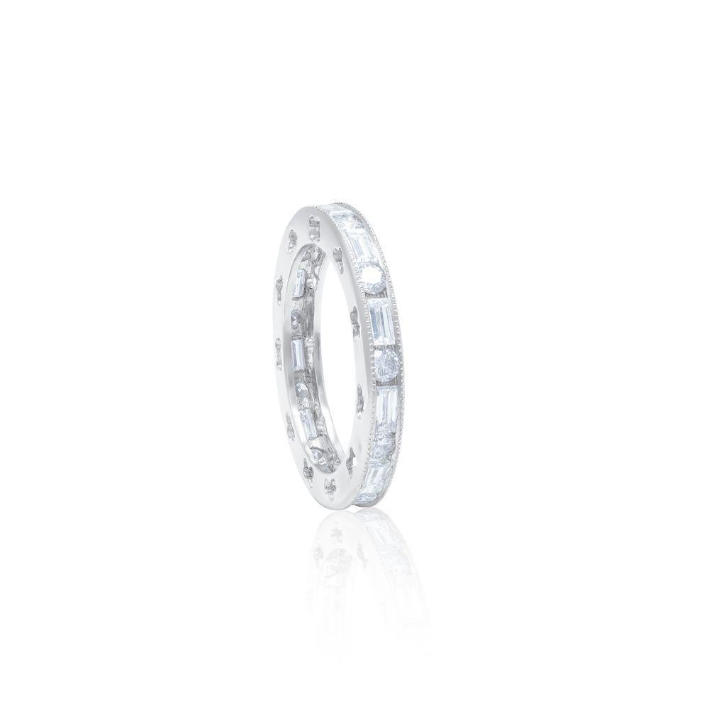 2.30 cts of rounds and baguettes set in a filigree eternity band setting in plat FG VS