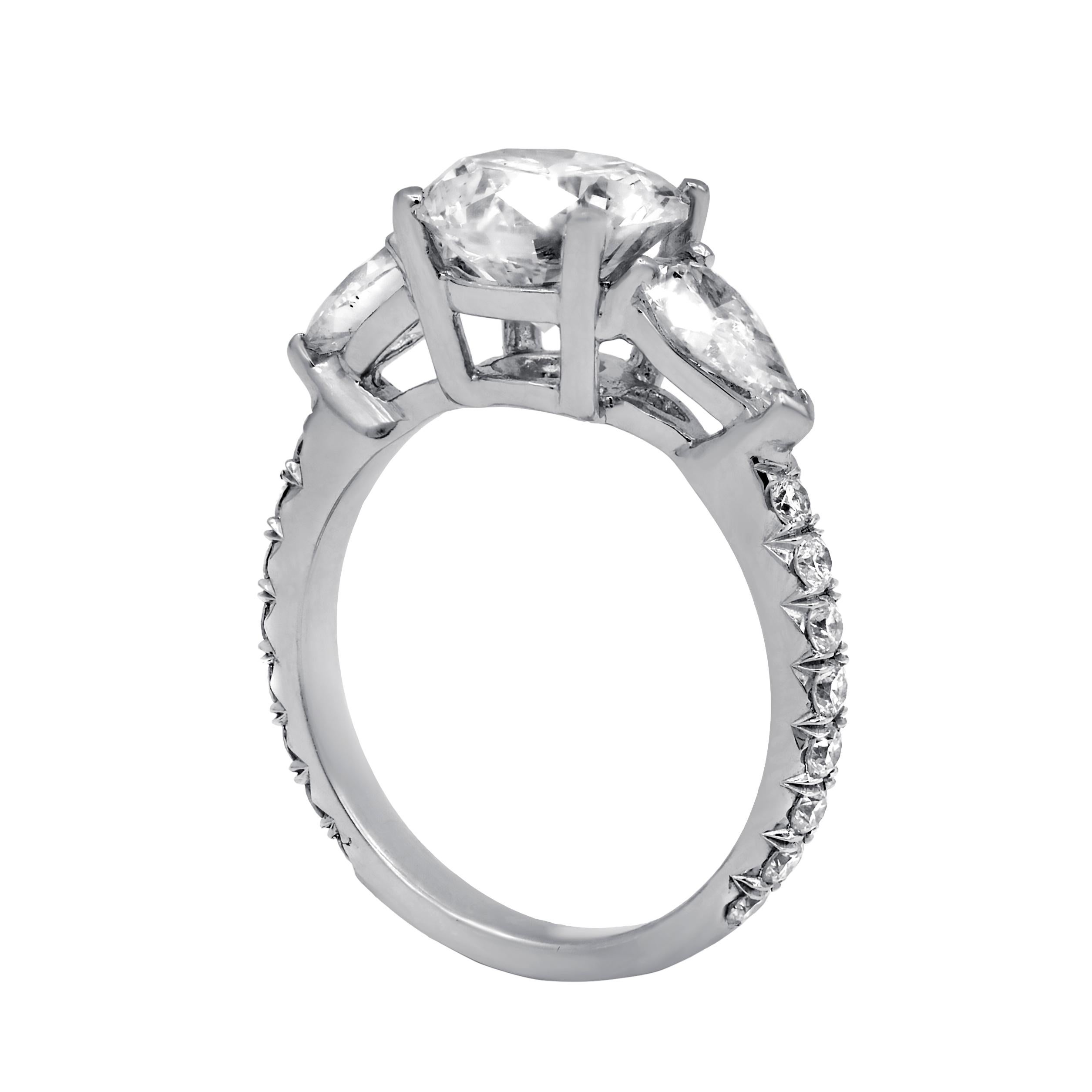 Platinum three stone engagement ring featuring a center (G-VS2) 2.44 ct diamond with 1.35 cts tw of diamond on the sides 