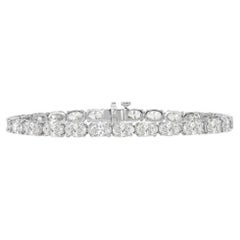 Diana M. Bracelet tennis en platine à 4 griffes avec diamants ovales 14,31 carats 