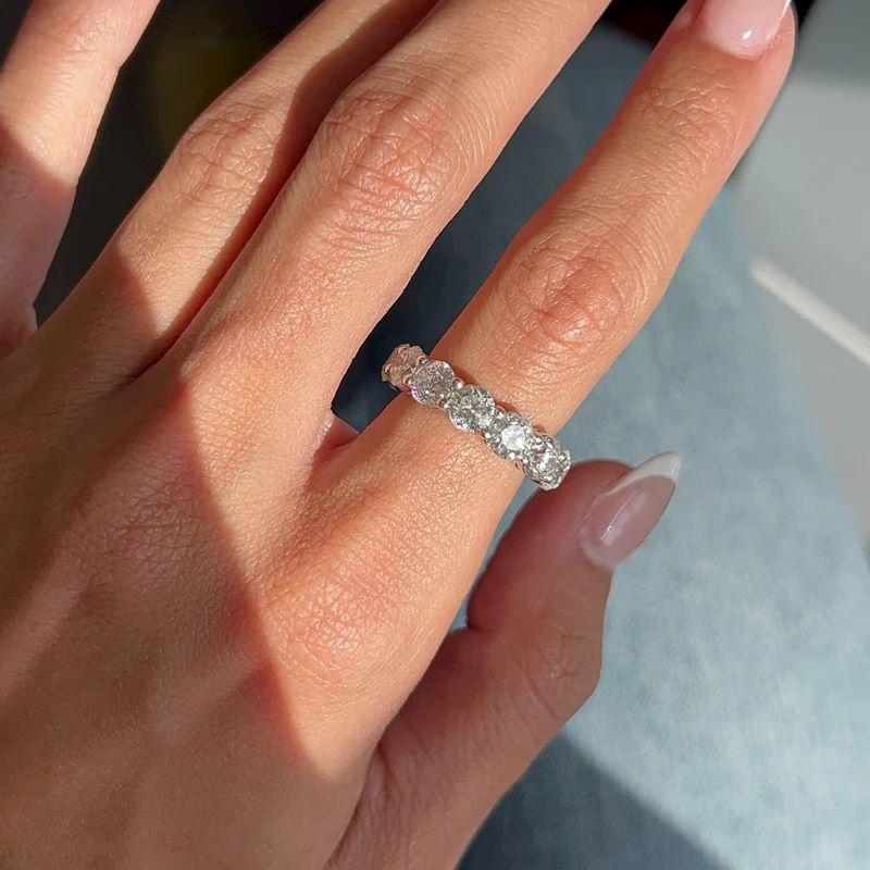 Diana M. Platinum 7.05 Cts Round Brilliant Cut Diamond Eternity Band In New Condition For Sale In New York, NY