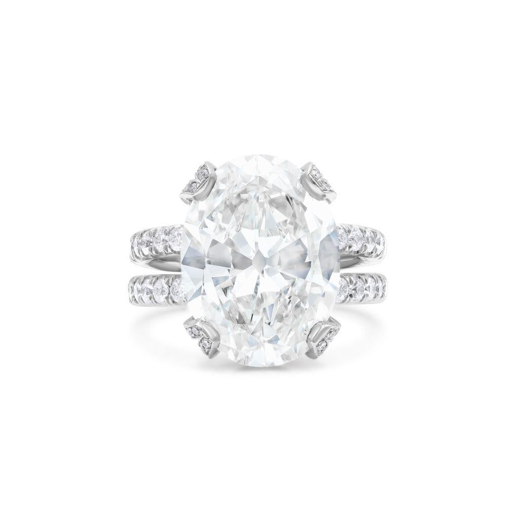 Platinum engagement ring featuring a center 6.88 ct oval cut diamond(#GIA 2165680950) (H-VS2) with 1.50 cts tw of diamonds on a split shank band