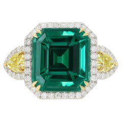 Diana M. Platinum and 18 kt yellow gold emerald diamond ring featuring a 13.69 
