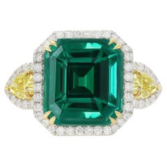 Diana M. Platinum and 18 kt yellow gold emerald diamond ring featuring a 13.69
