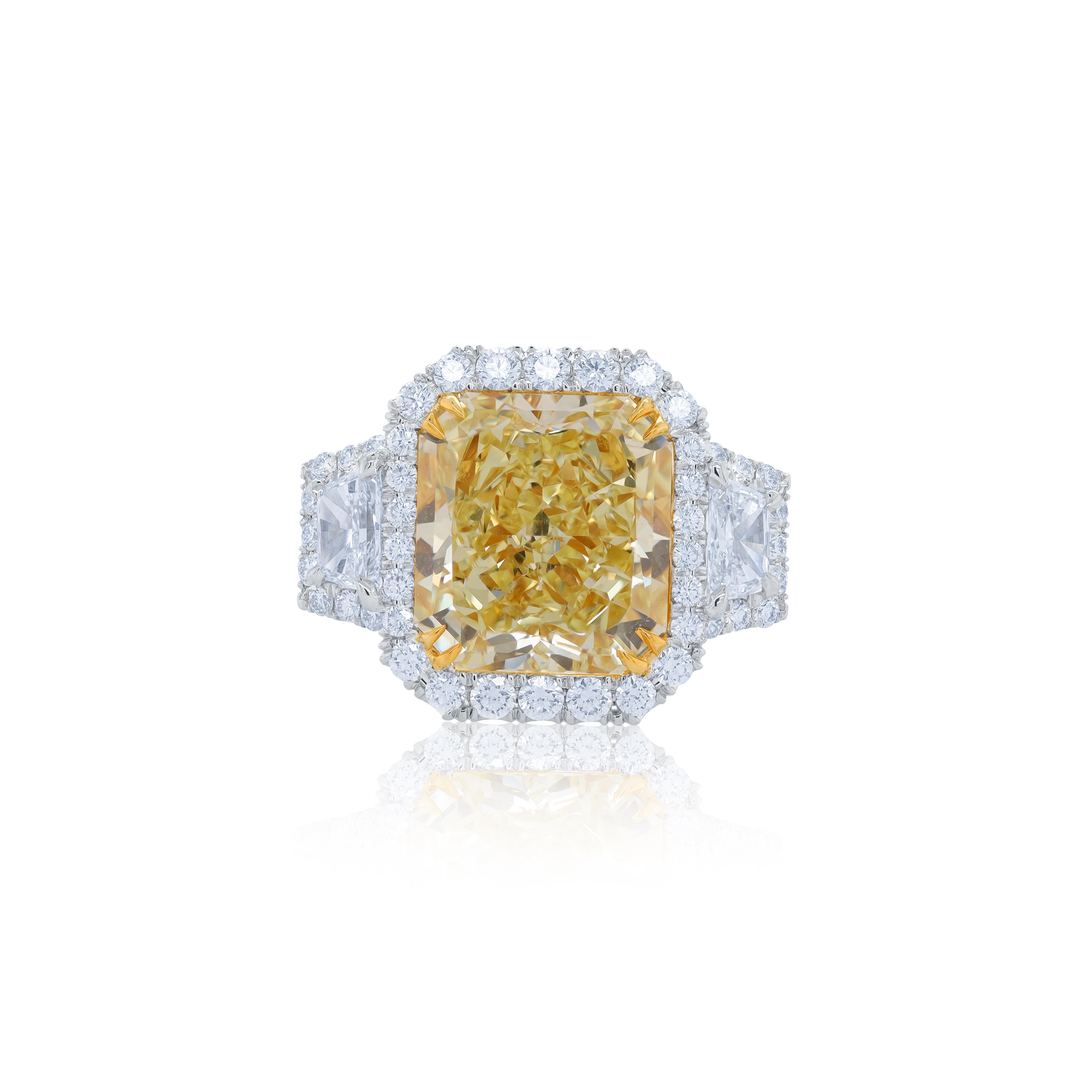 Platinum and 18 kt yellow gold engagement ring featuring a center (FY VVS2) 9.17 ct radiant cut diamond GIA#2135253194 with 2.10 cts tw of trapezoid and round diamonds around 
Diana M is one-stop shop for all your jewelry shopping, carrying line of