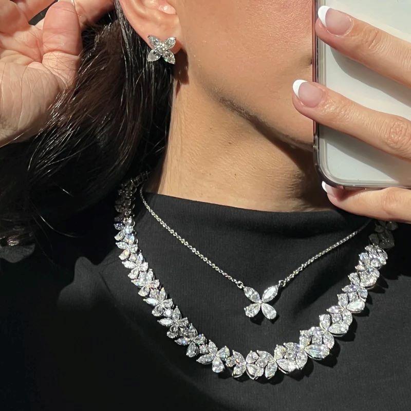 Diana M. Platinum Clover Stud Earrings Adorned with 7.11Ct GIA Certified Diamond In New Condition For Sale In New York, NY