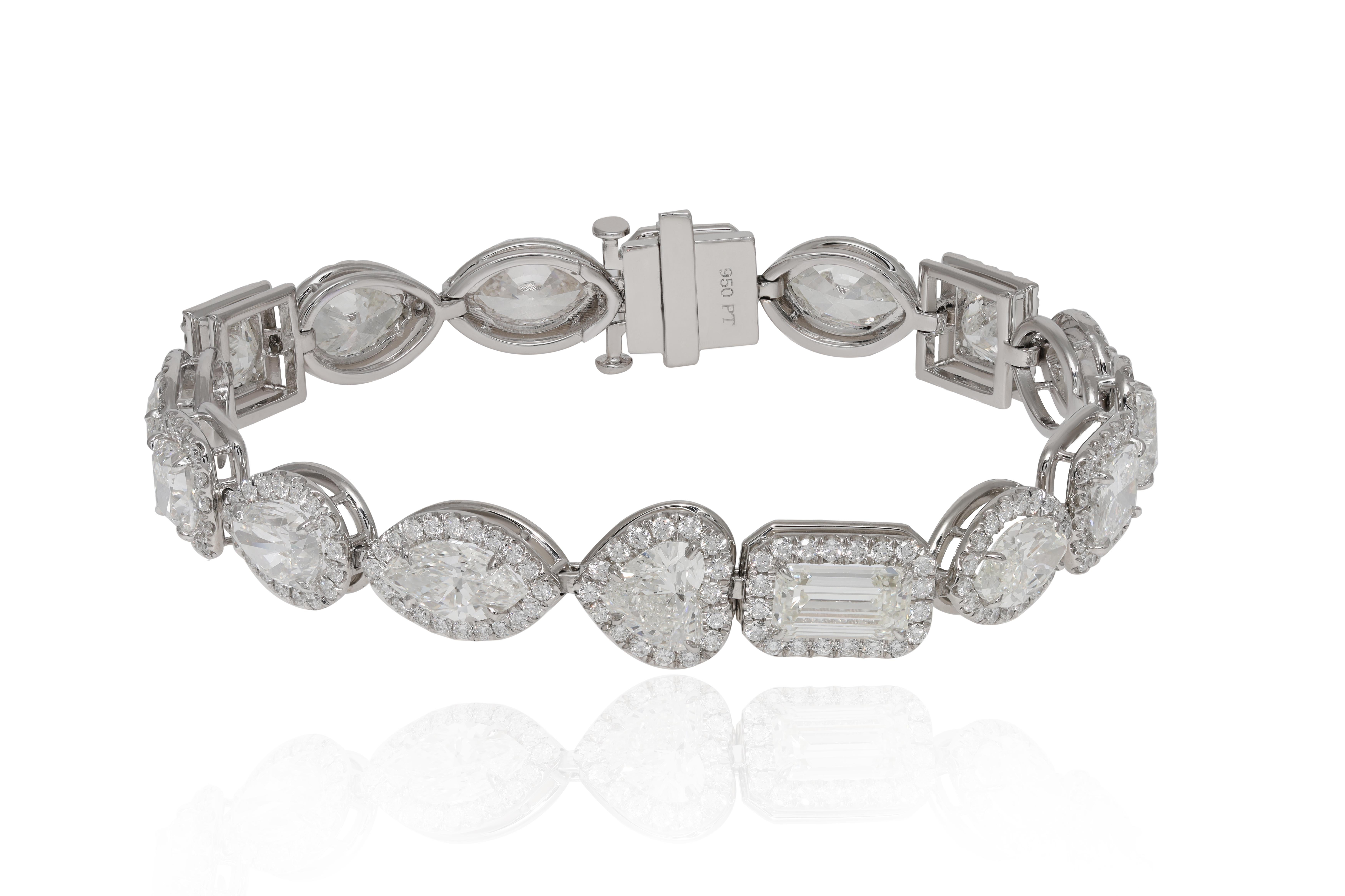 Platinum diamond bracelet featuring 16.44 cts of multi-shaped GIA certified diamonds surrounded by 3.00 cts of round diamonds forming a halo design (GHI-VVS2-SI2)
Diana M. is a leading supplier of top-quality fine jewelry for over 35 years.
Diana M