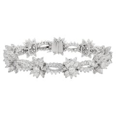 Diana M. Platinum diamond fashion bracelet featuring snow flake cluster design 