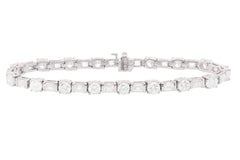 Diana M. Platinum diamond tennis bracelet adorned with 12.70 cts tw