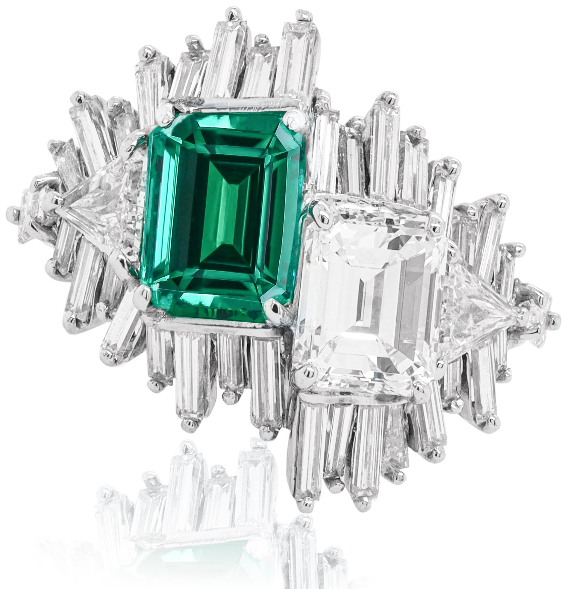 Platinum emerald and diamond ring featuring a 2.15 ct emerald and a 2.03 ct white diamond offset from each other surrounded by long baguette cut diamonds totaling 2.00 cts tw of diamonds (C.Dunaigre certified)
Diana M. is a leading supplier of