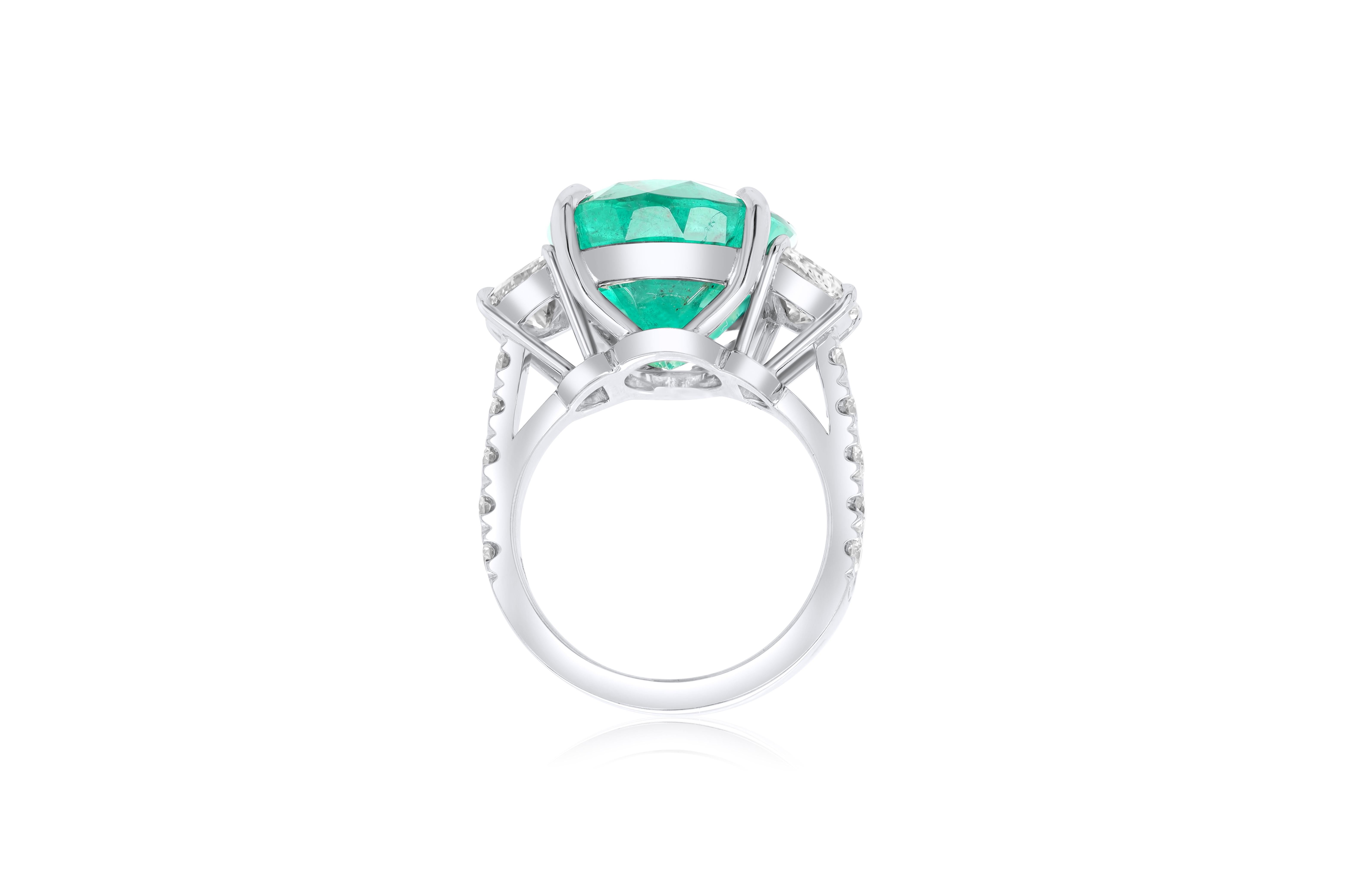 Modern Diana M. Platinum emerald and diamond ring featuring a center 13.50 ct oval cut  For Sale
