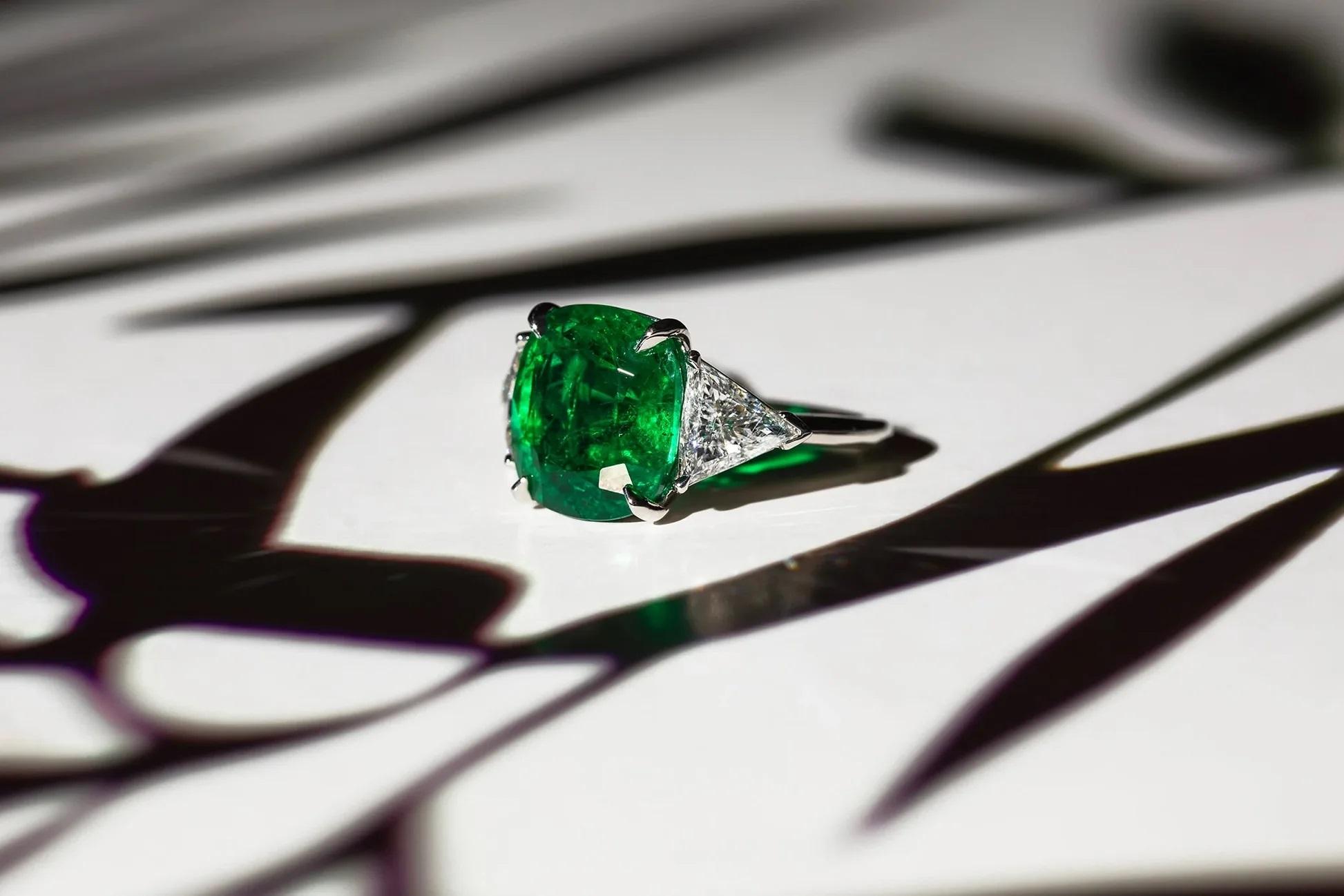 Platinum emerald diamond ring featuring a 7.70 ct cushion cut emerald with 2 trillions on the side weighing 1.59 cts (C. Dunaigre Certified).
Diana M. is a leading supplier of top-quality fine jewelry for over 35 years.
Diana M is one-stop shop for