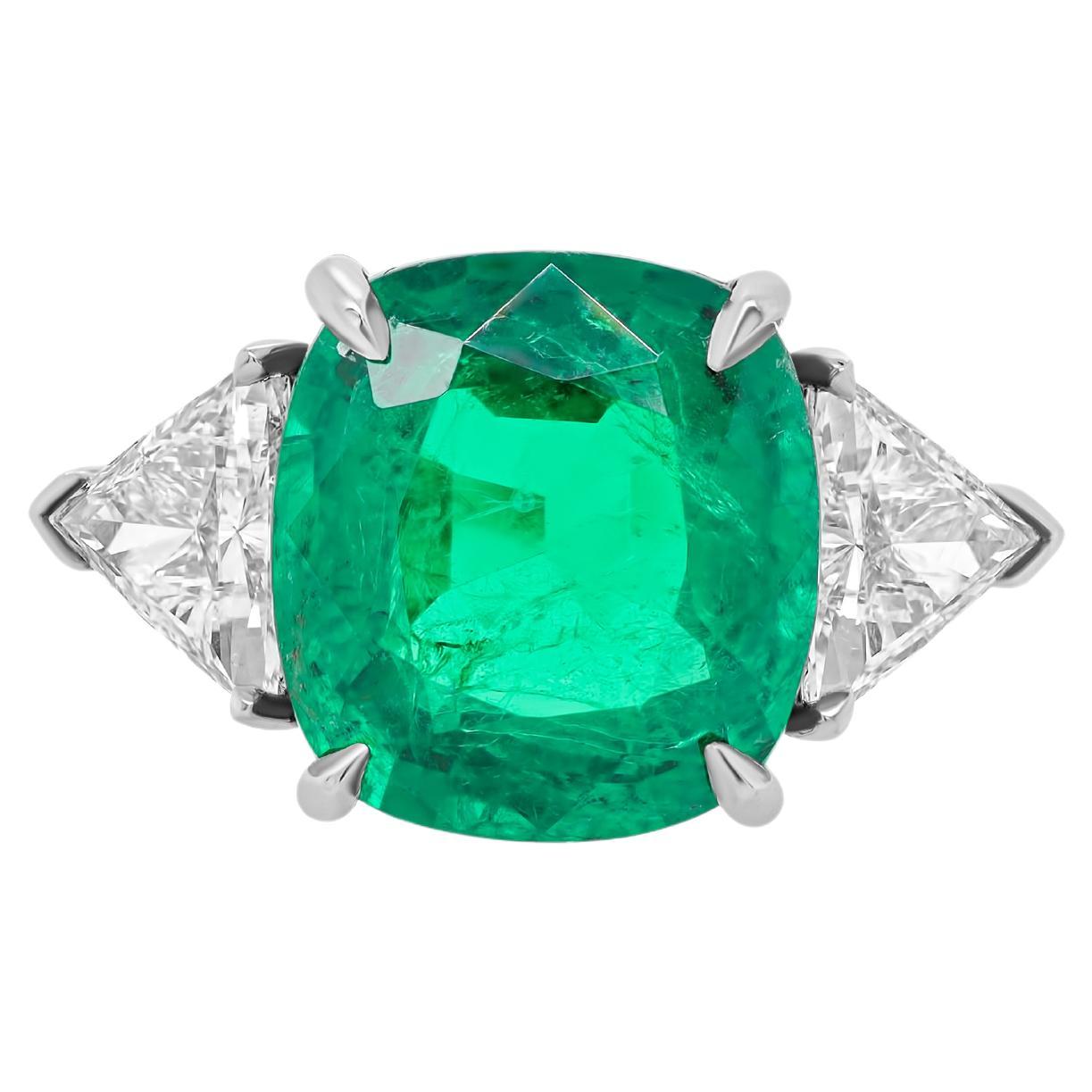 Diana M. Platinum emerald diamond ring featuring a 7.70 ct cushion cut 