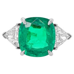 Diana M. Platinum emerald diamond ring featuring a 7.70 ct cushion cut 