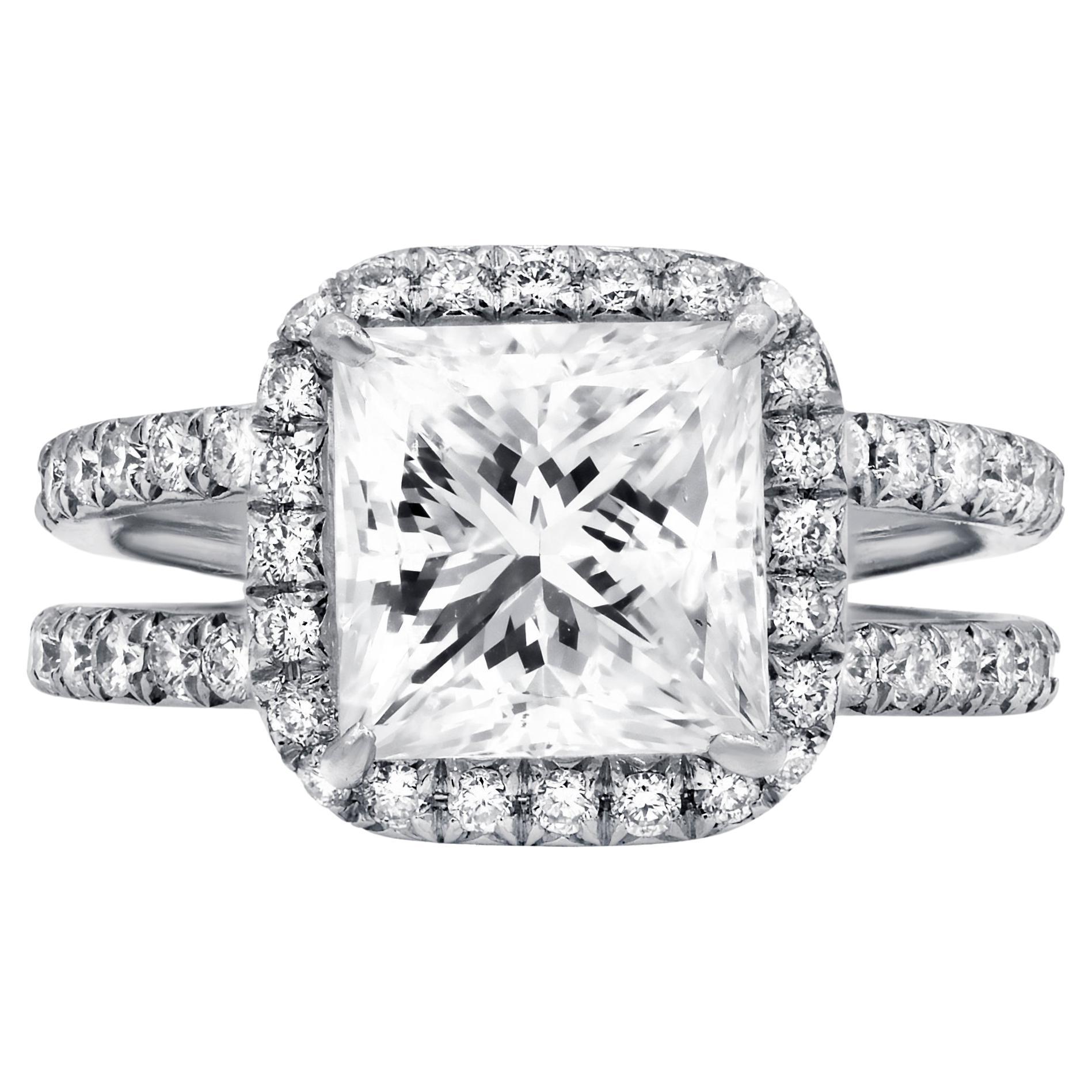 Platinum engagement ring featuring a center 3.00 ct GIA certified (GIA#13280902) (G-VS2) princess cut diamond surrounded by 1.40 cts tw of diamonds in a halo design 
Diana M. is a leading supplier of top-quality fine jewelry for over 35 years.
Diana