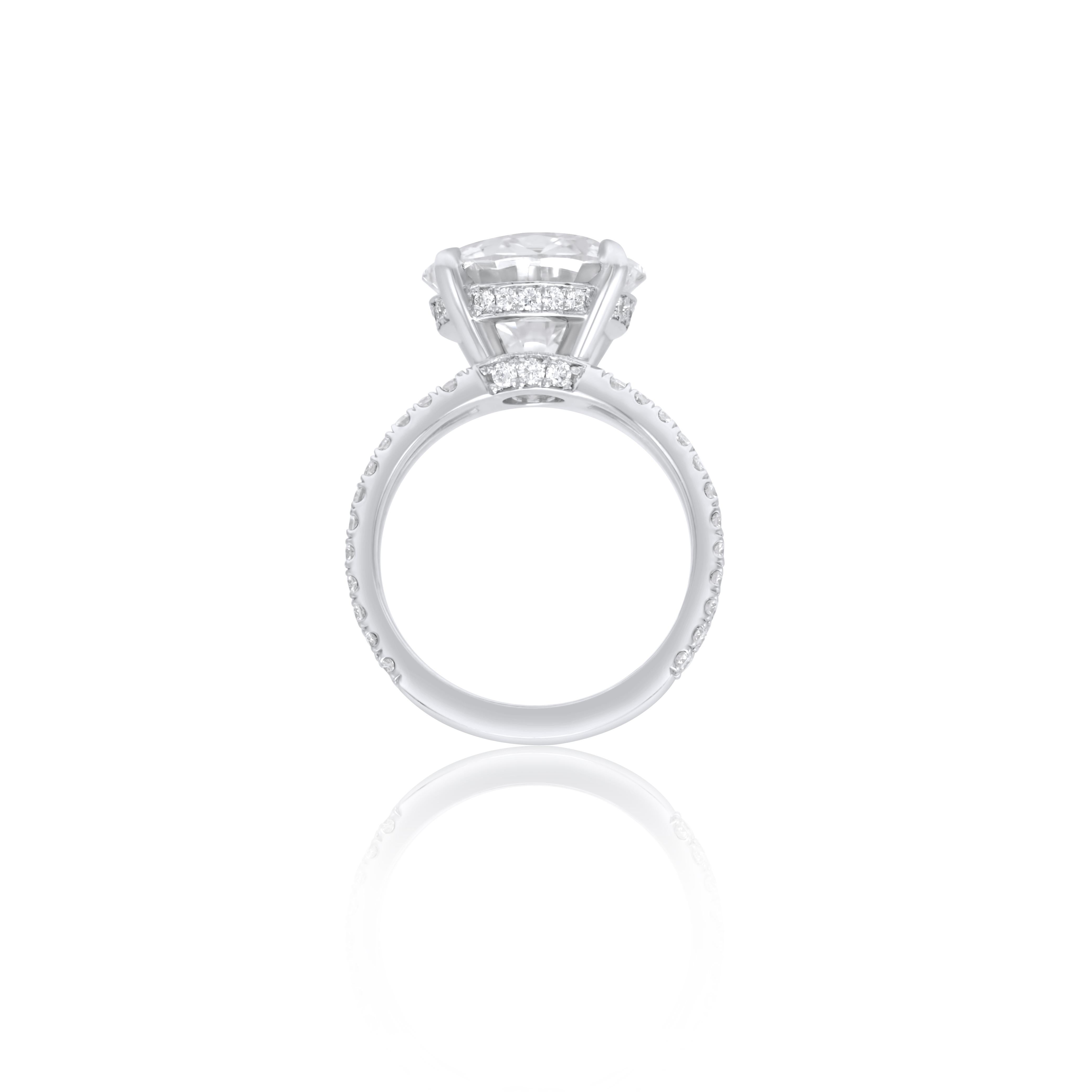 Modern DIANA M. Platinum engagement ring featuring a center 6.30 ct round diamond For Sale