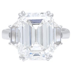 DIANA M. Platinum engagement ring featuring a center 8.08 ct emerald cut diamond