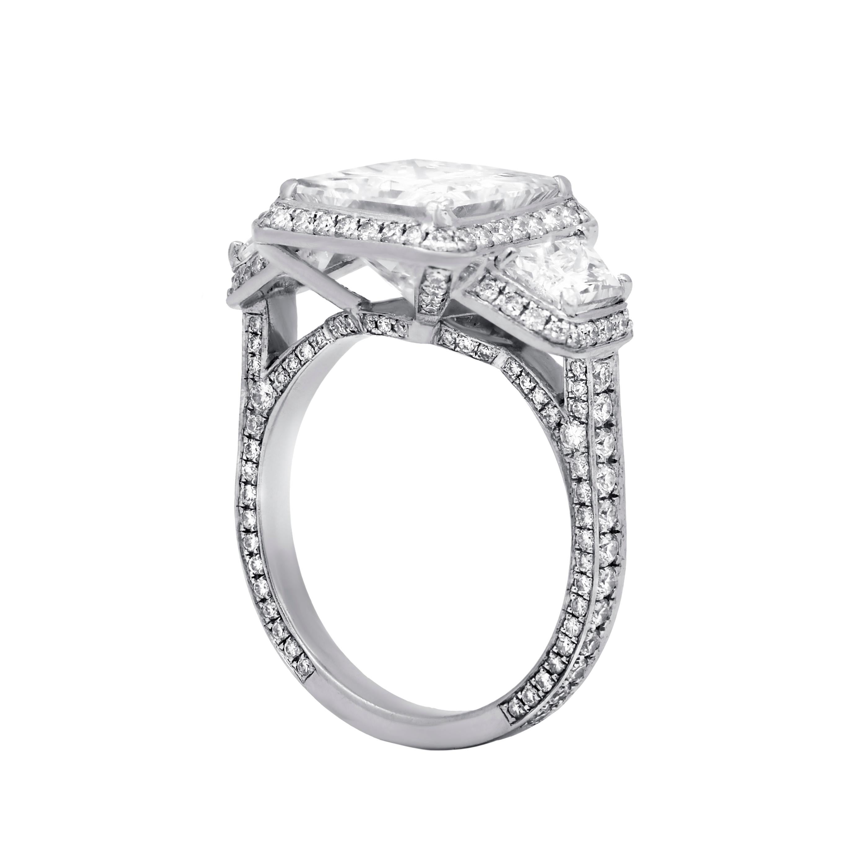 Platinum engagement ring featuring a center (I-VVS1) 3.45 ct princess cut diamond with 2.47 cts tw of trapezoid diamonds on the sides 
Diana M. is a leading supplier of top-quality fine jewelry for over 35 years.
Diana M is one-stop shop for all