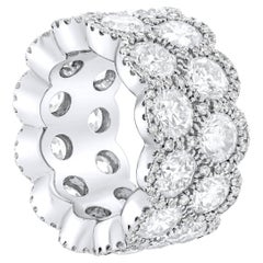 Diana M. platinum eternity band with halo setting features 12.06 ct of 24 round