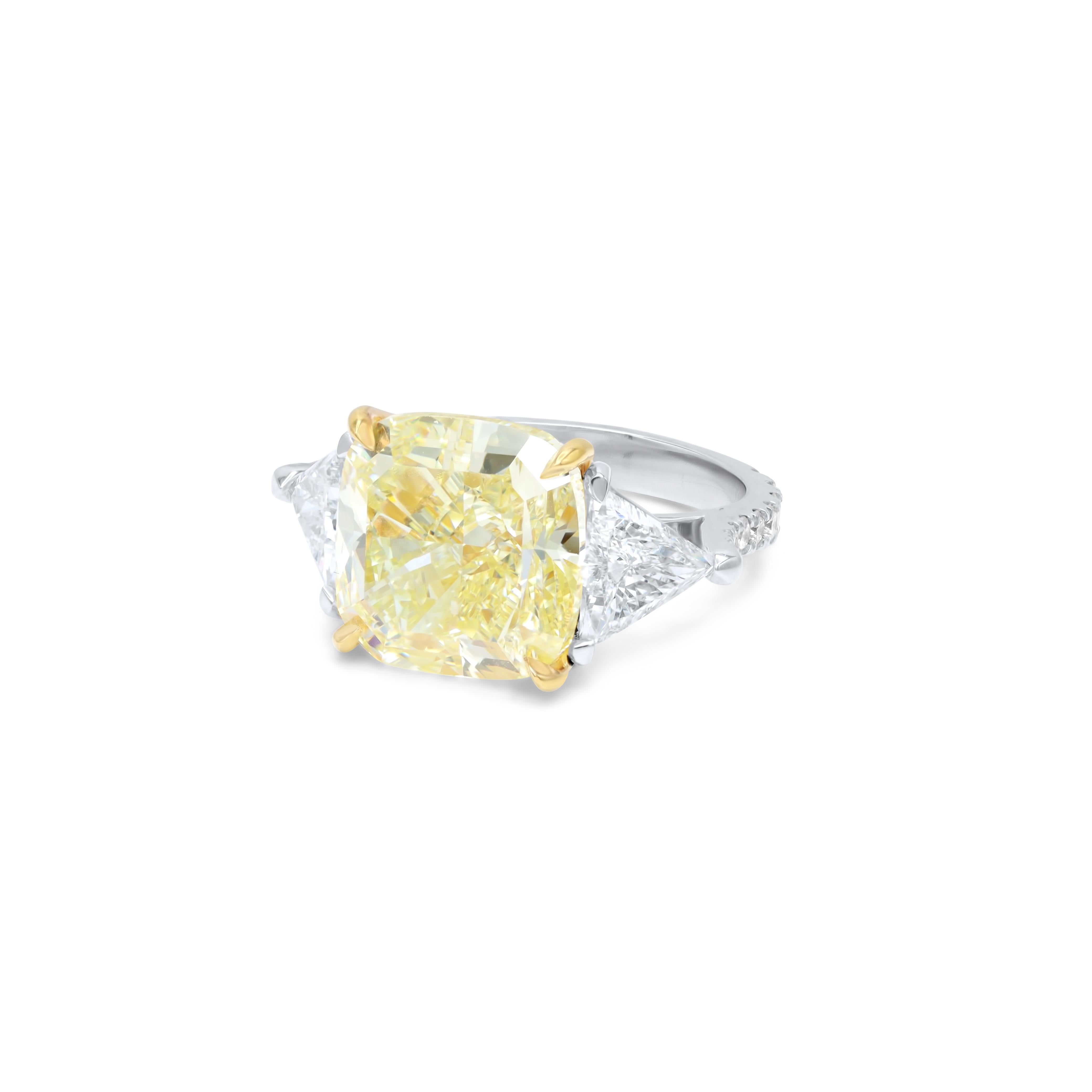 Platinum and 18 kt yellow gold engagement ring featuring a center (FLY VS1) 10.01 ct cushion cut yellow diamond(GIA# 2225261697) with 2.10 cts tw of diamonds on the sides (1.49 cts of trapezoids)
Diana M is one-stop shop for all your jewelry