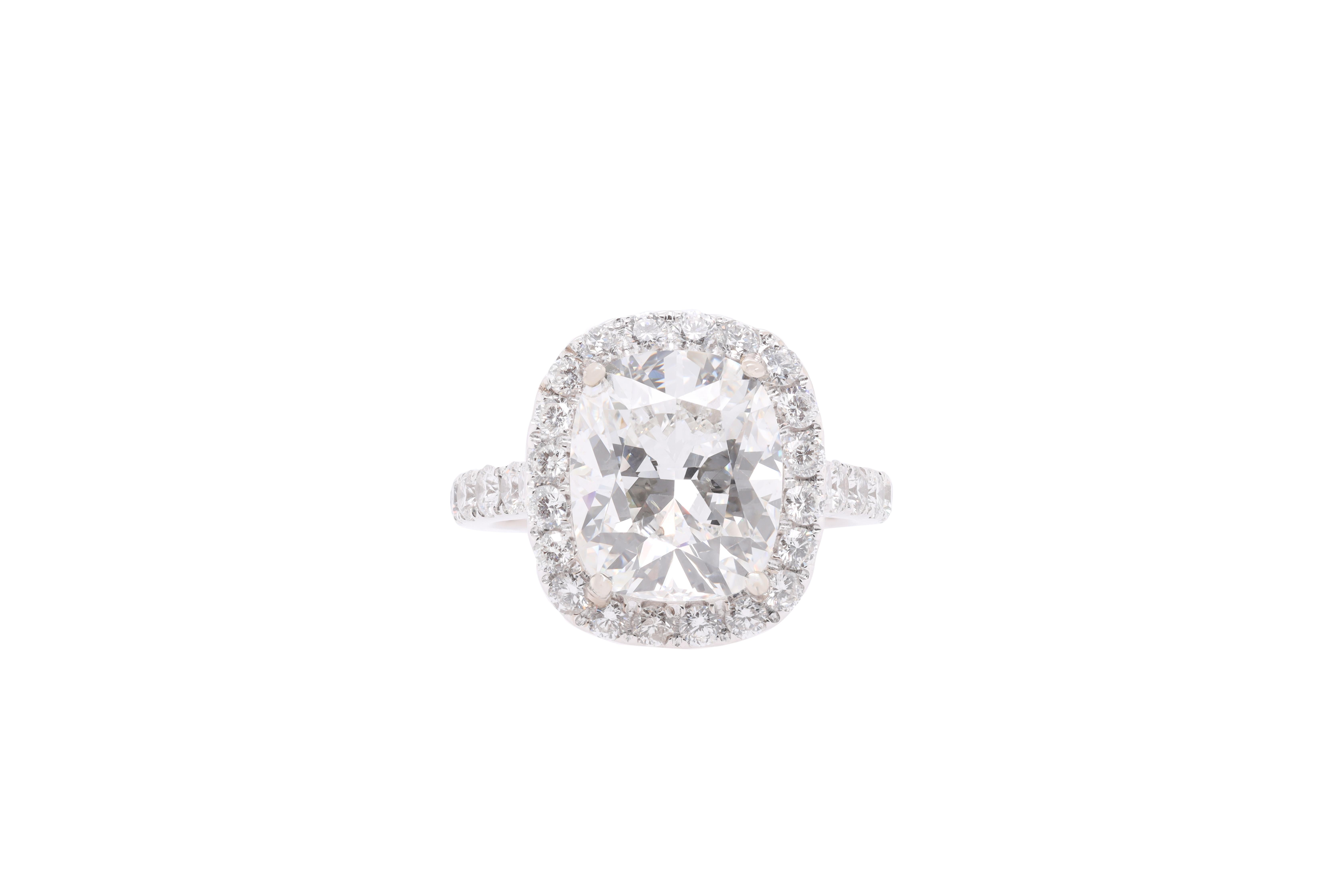 Platinum engagement ring featuring a center (F-SI2) 6.19 ct cushion cut GIA certified diamond with 1.25 cts tw of pave diamond  halo w/diamonds on the band #5171433598