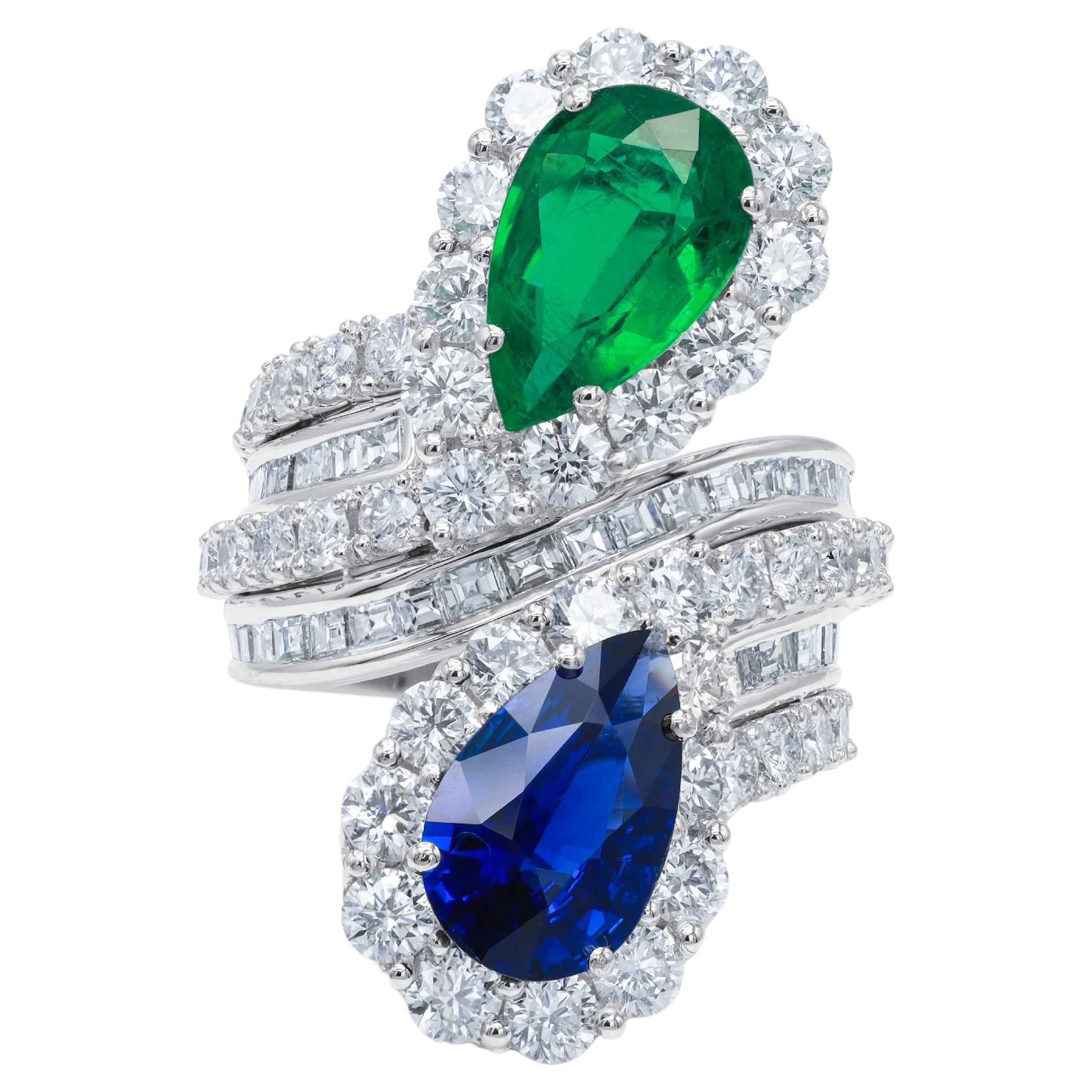 Diana M. Platinum sapphire and emerald ring with a spiral design  For Sale