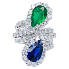 Diana M. Platinum sapphire and emerald ring with a spiral design 