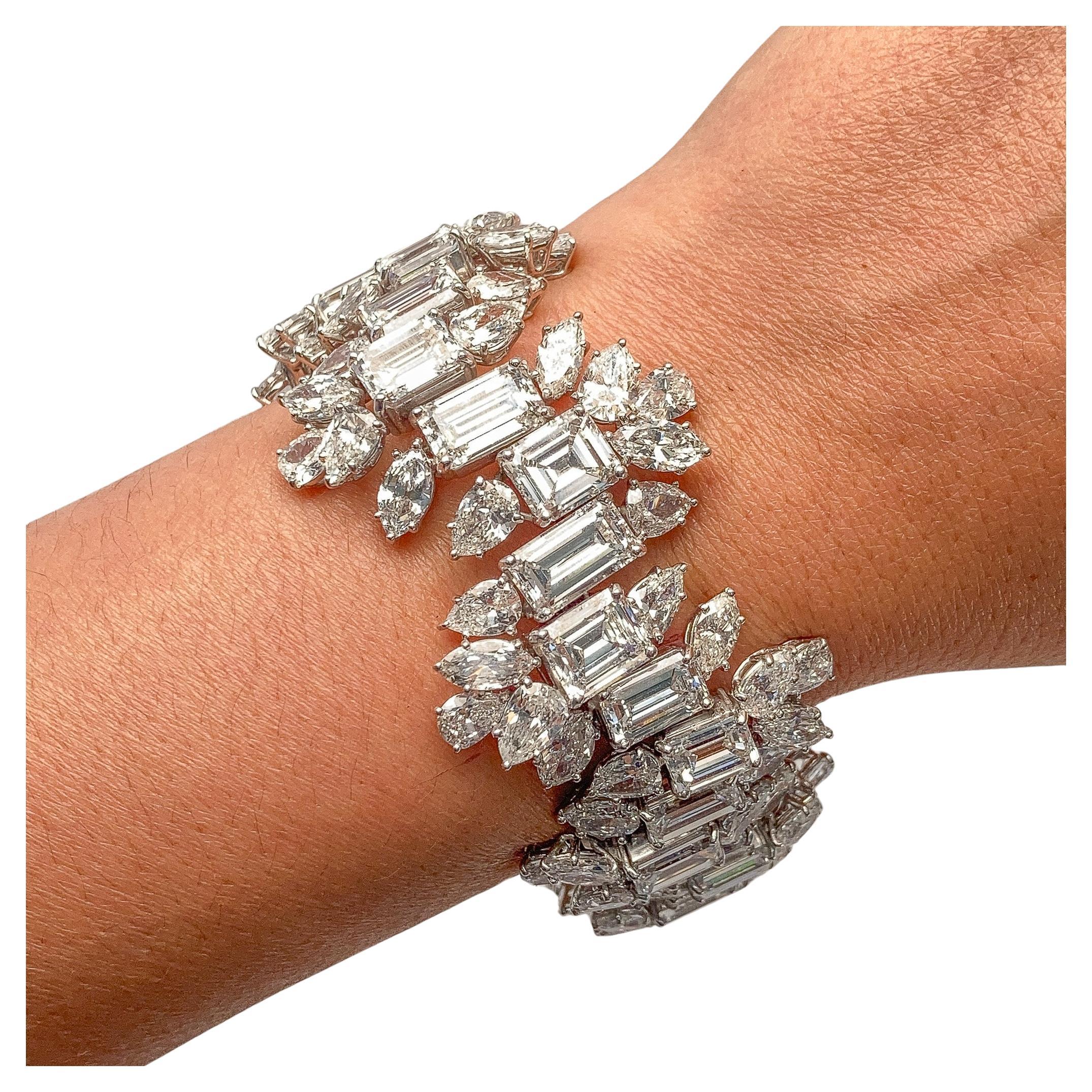 Diana M one-of-a-kind custom multi-shaped emerald, pear, marquis and round diamond bracelet, starting from 2 cts down set in prongs all GIA Certified DEF colors VVS-VS Clarity 96 cts. 7 inches. Between 3/4 to 1 inch wide. 


