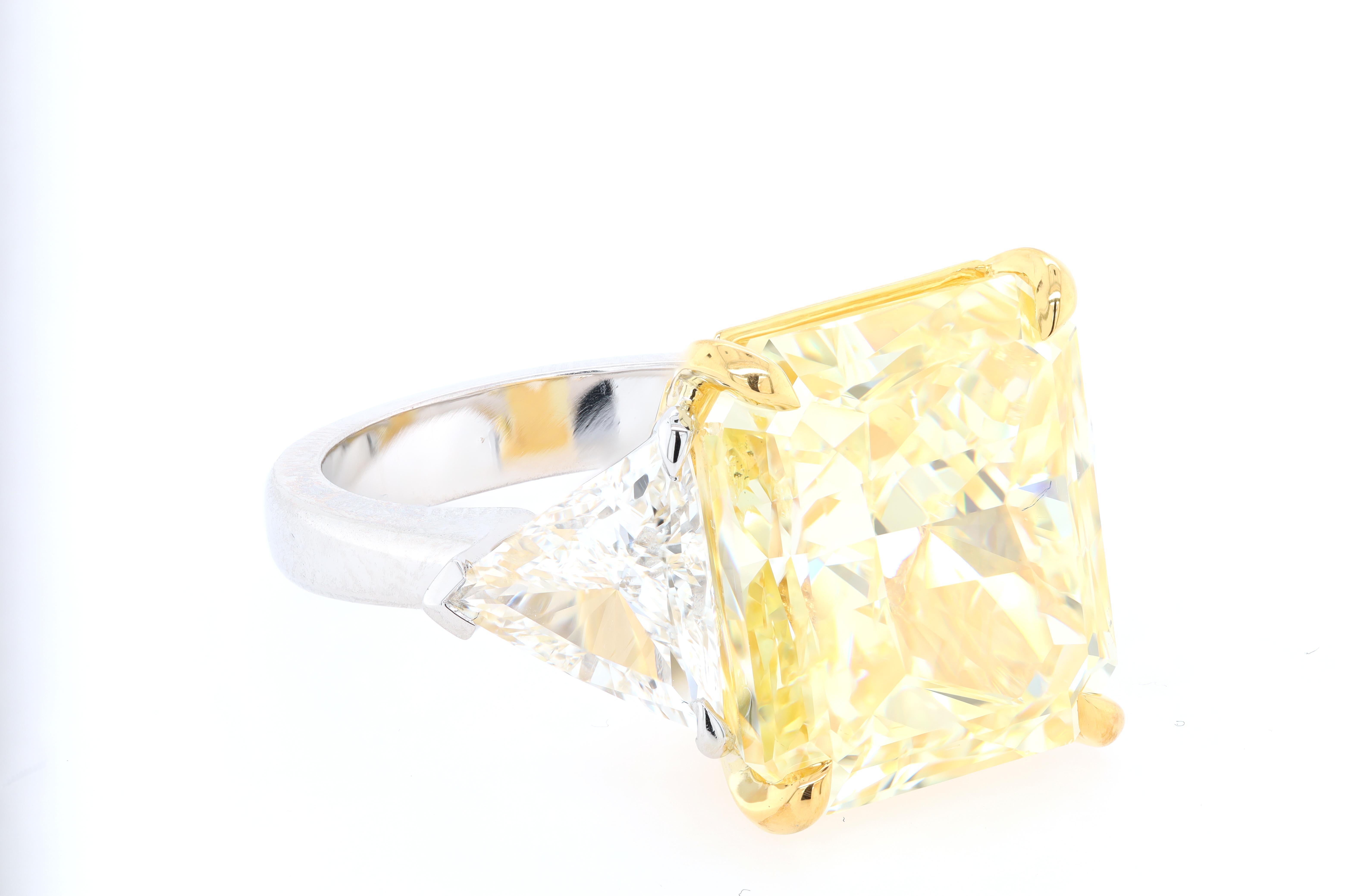 Modern Diana M. Fancy Intense Yellow Diamond 23.88cts VS2 Set with 2cts Trillions GIA For Sale