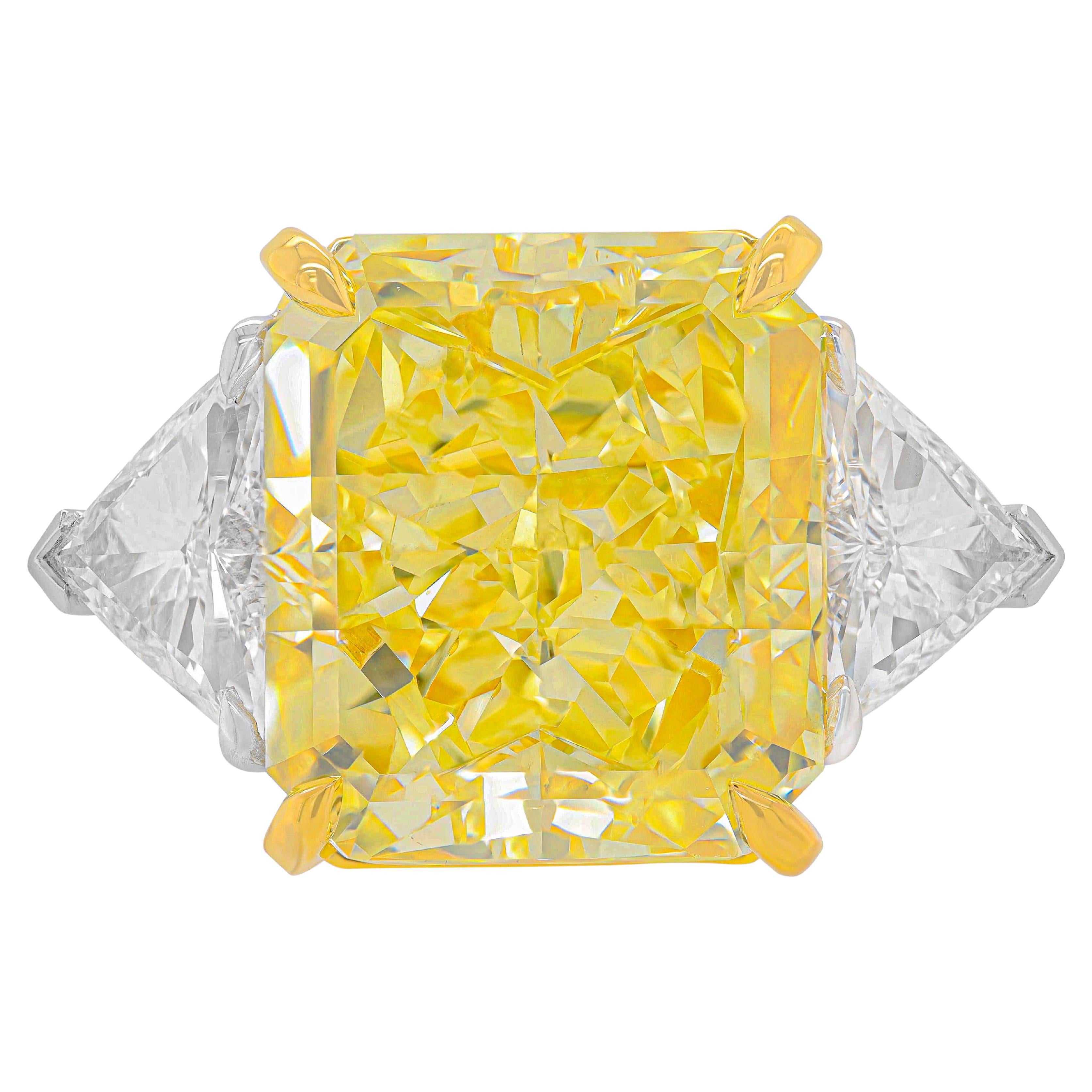 Diana M. Fancy Intense Yellow Diamond 23.88cts VS2 Set with 2cts Trillions GIA For Sale