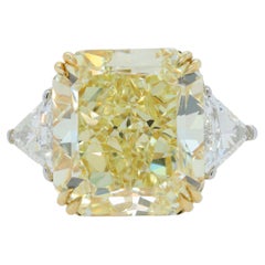 Diana M. Vivid Diamond 23.88ct VS2 GIA With 2 trillants 1.56cts Set In Platinum