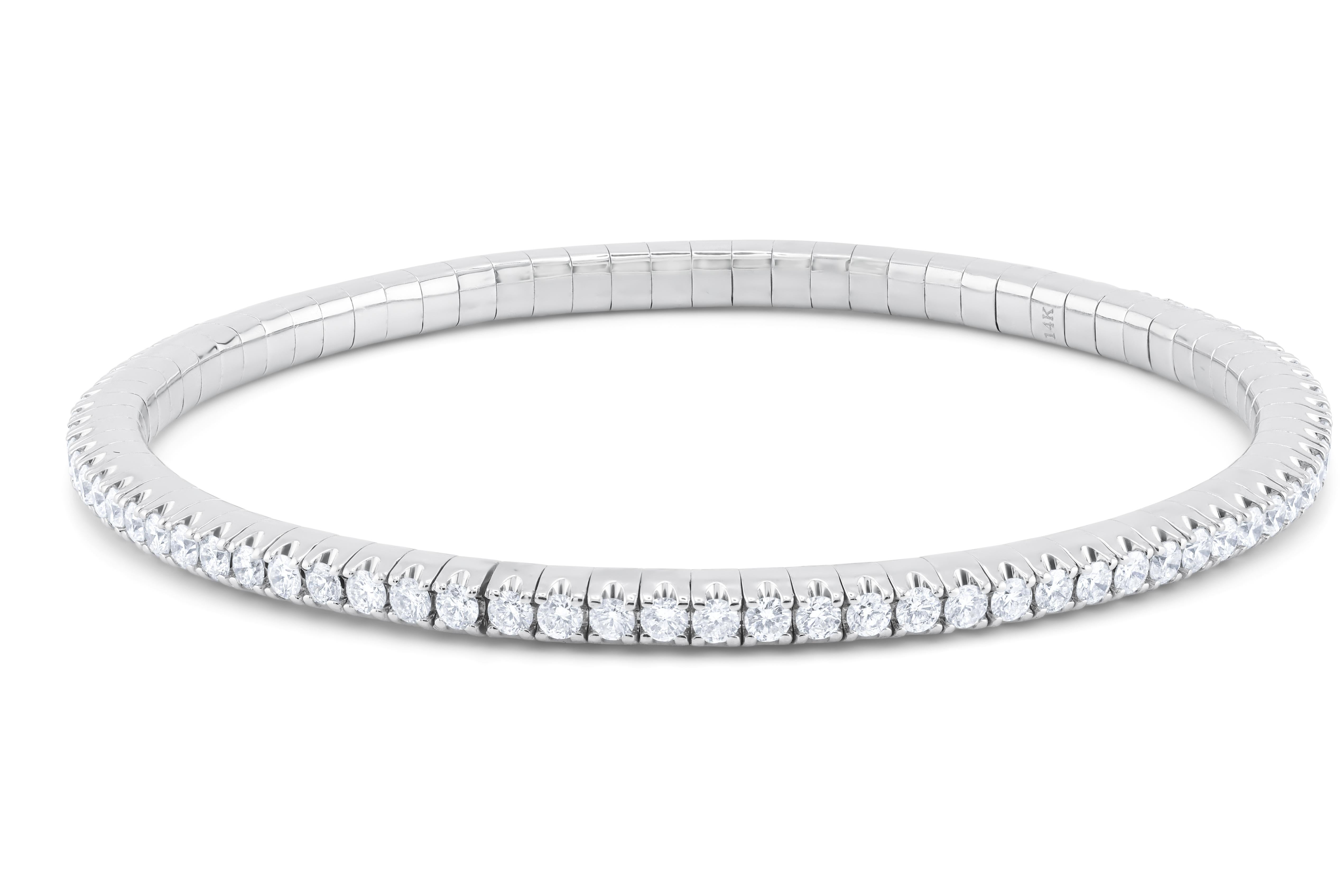 14kt white gold flexible slip on bangle containing 3.25cts of white round diamonds 