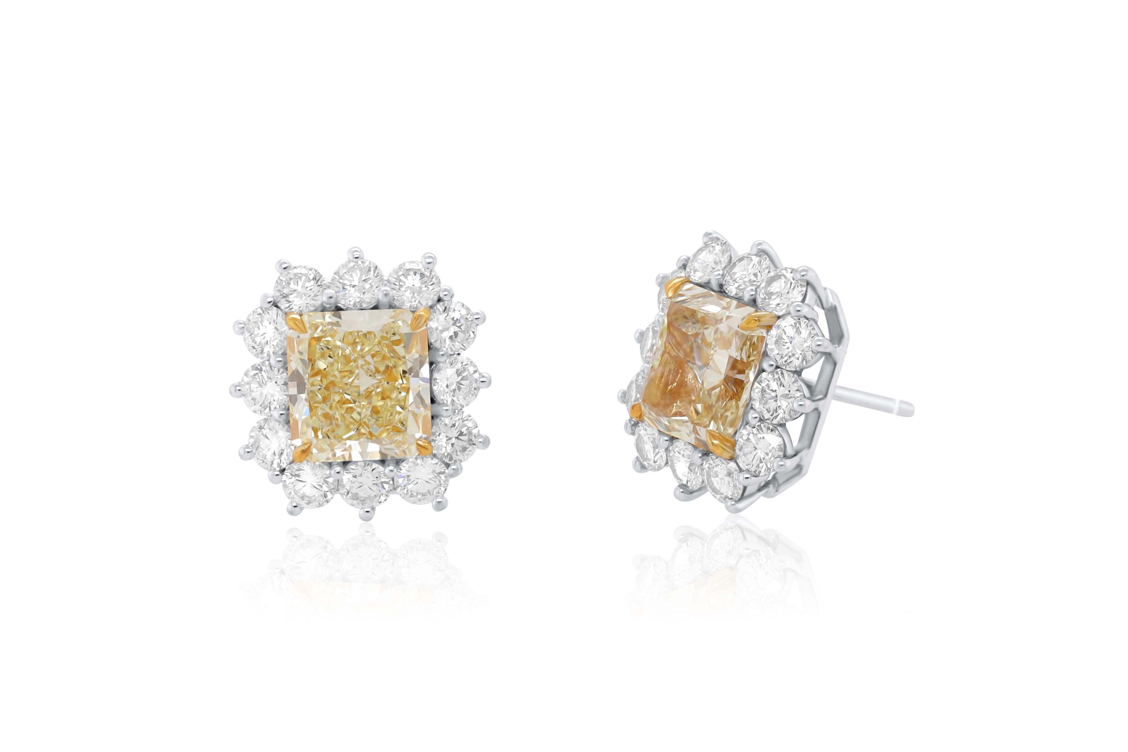 18KT WHITE AND YELLOW GOLD DIAMOND STUDS, FEATURES 6.79ct OF TWO  GIA#5211187110 &1216111794 CERTIFIED RADIANT CUT DIAMONDS FANCY YELLOW VVS1-IN A DIAMOND HALO 3.00CTS OF DIAMONDS ON SIDES.
Diana M. is a leading supplier of top-quality fine jewelry