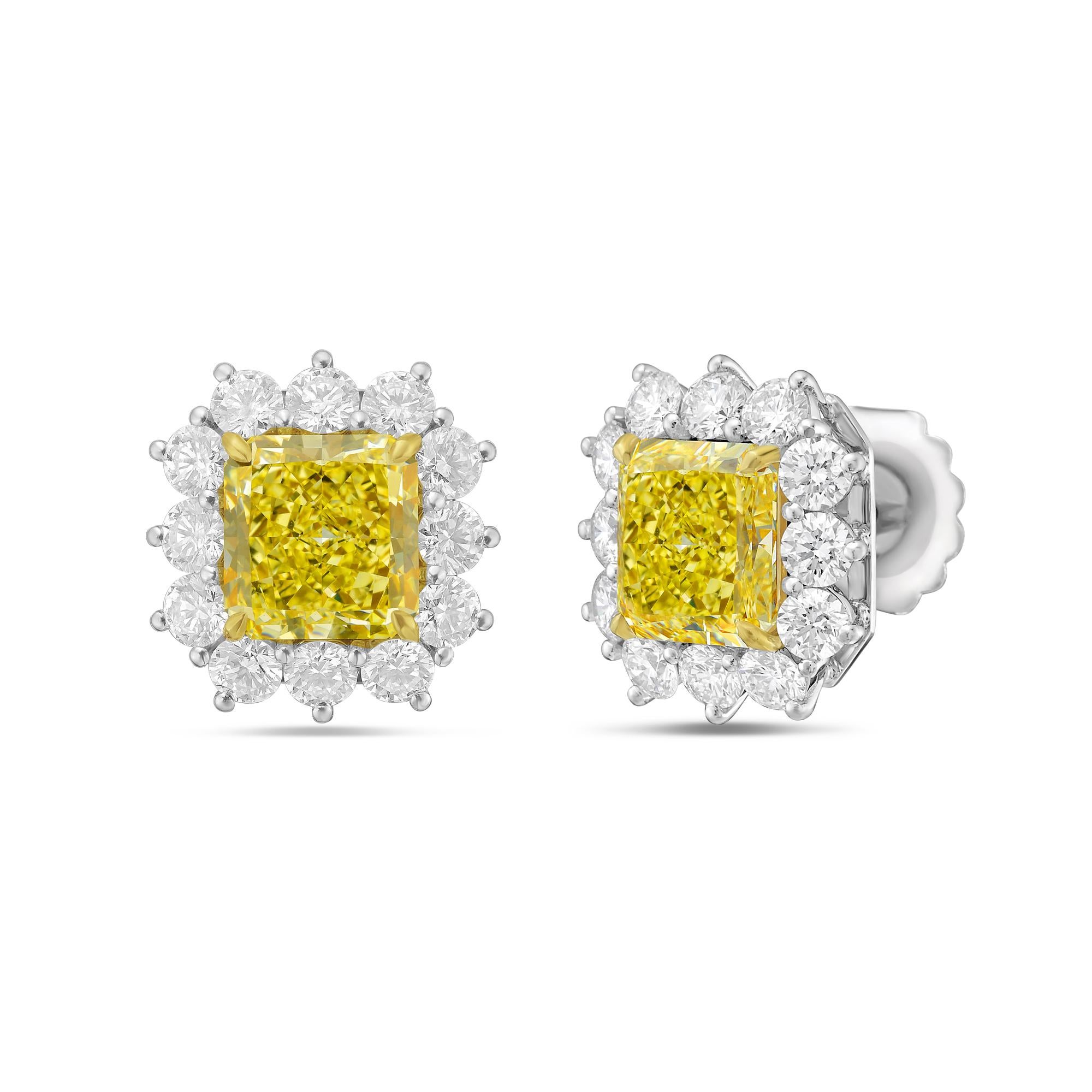 18KT WHITE AND YELLOW GOLD DIAMOND STUDS, FEATURES 6.79ct OF TWO  GIA#5211187110 &1216111794 CERTIFIED RADIANT CUT DIAMONDS FANCY YELLOW VVS1-IN A DIAMOND HALO 3.00CTS OF DIAMONDS ON SIDES.
Diana M. is a leading supplier of top-quality fine jewelry