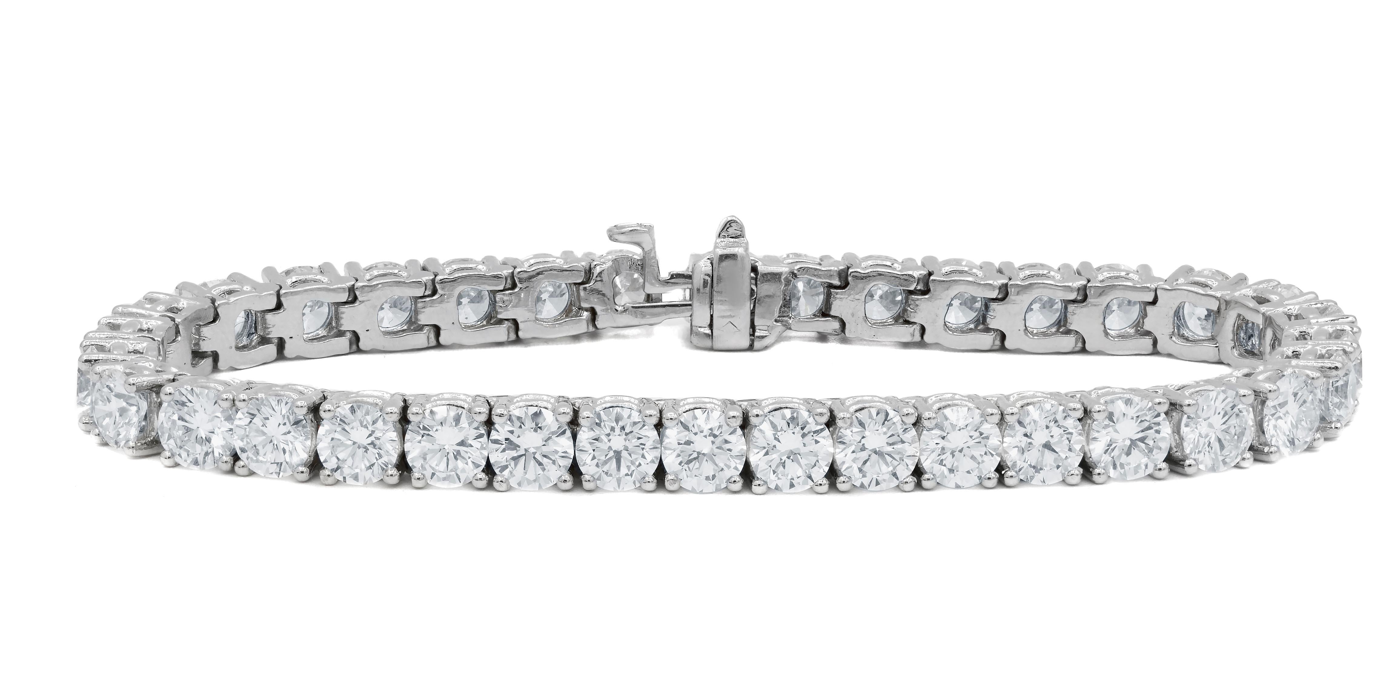 14kt white gold custom tennis bracelet featuring 10.00 cts of round diamonds 38 stones 0.25 each color GH clarity SI. Excellent Cut.
