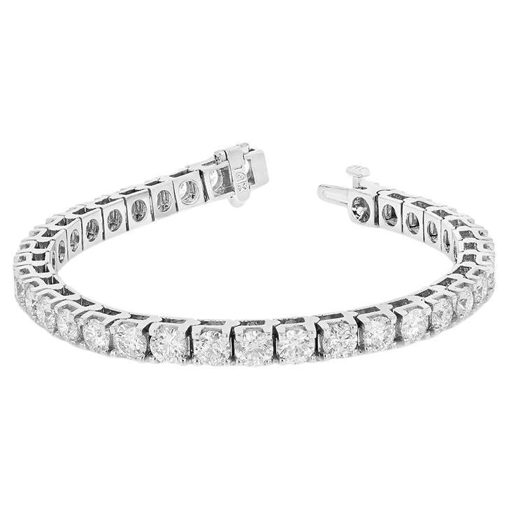 Custom 14kt white gold tennis bracelet  4.59 cts of round diamonds set in 4 prongs setting  55 stones 0.09 each GH color SI clarity.  Excellent Cut.
