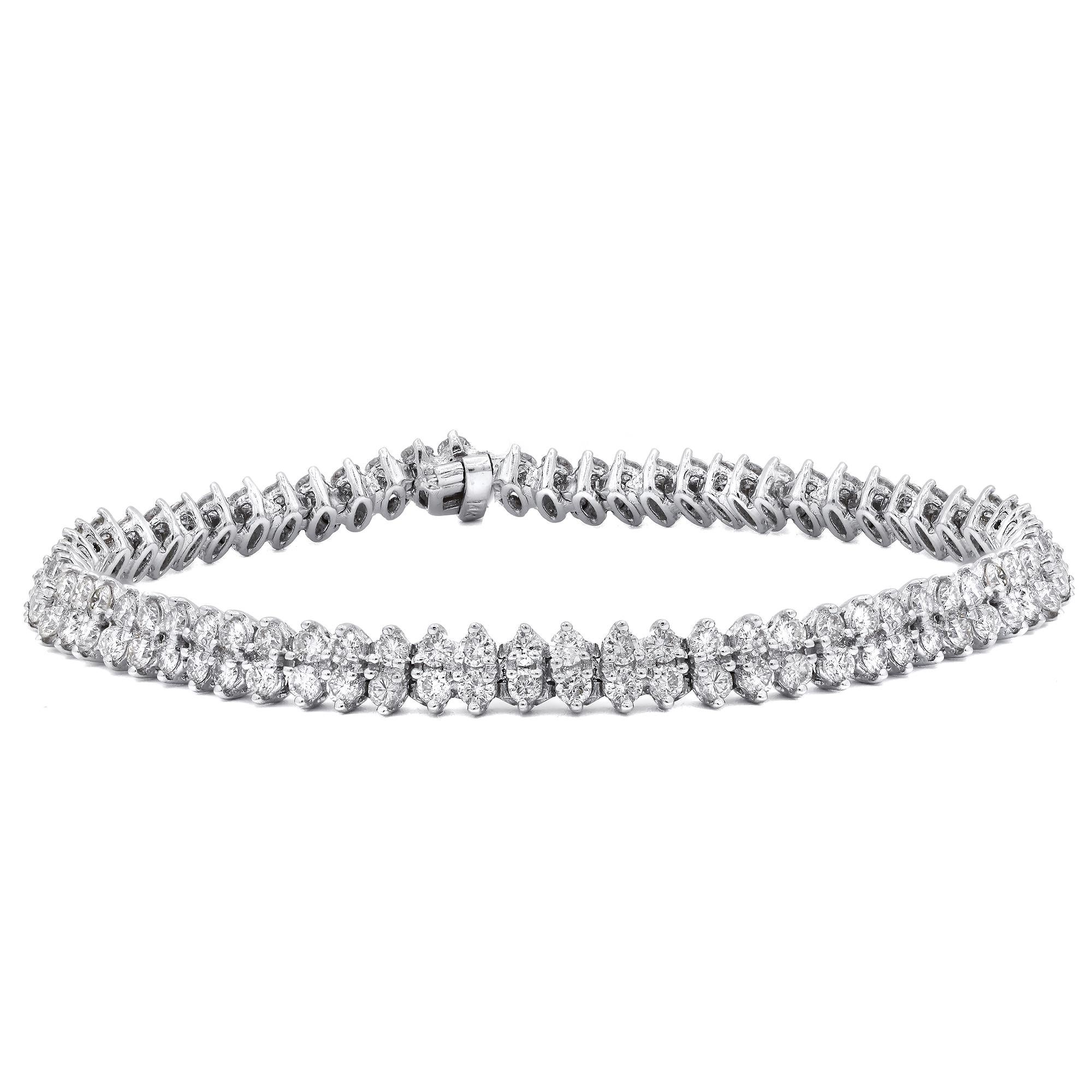 14kt white gold tennis bracelet featuring 5.00 cts tw of round diamonds GH VS SI
Diana M. is a leading supplier of top-quality fine jewelry for over 35 years.
Diana M is one-stop shop for all your jewelry shopping, carrying line of diamond rings,