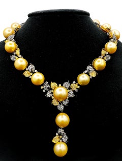 Diana M.18 kt oro blanco y amarillo rodiado negro perla y diamantes