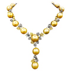 Diana M.18 kt white and yellow gold black rhodium plated pearl and diamonds