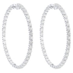 Diana M.18 kt white gold, 2.50" inside-out hoop earrings adorned with 19.00 cts 