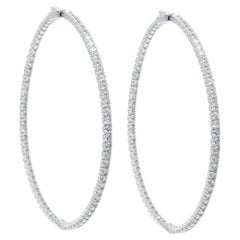 Diana M.18 kt white gold, 2.50" inside-out hoop earrings adorned with 7.40 cts 