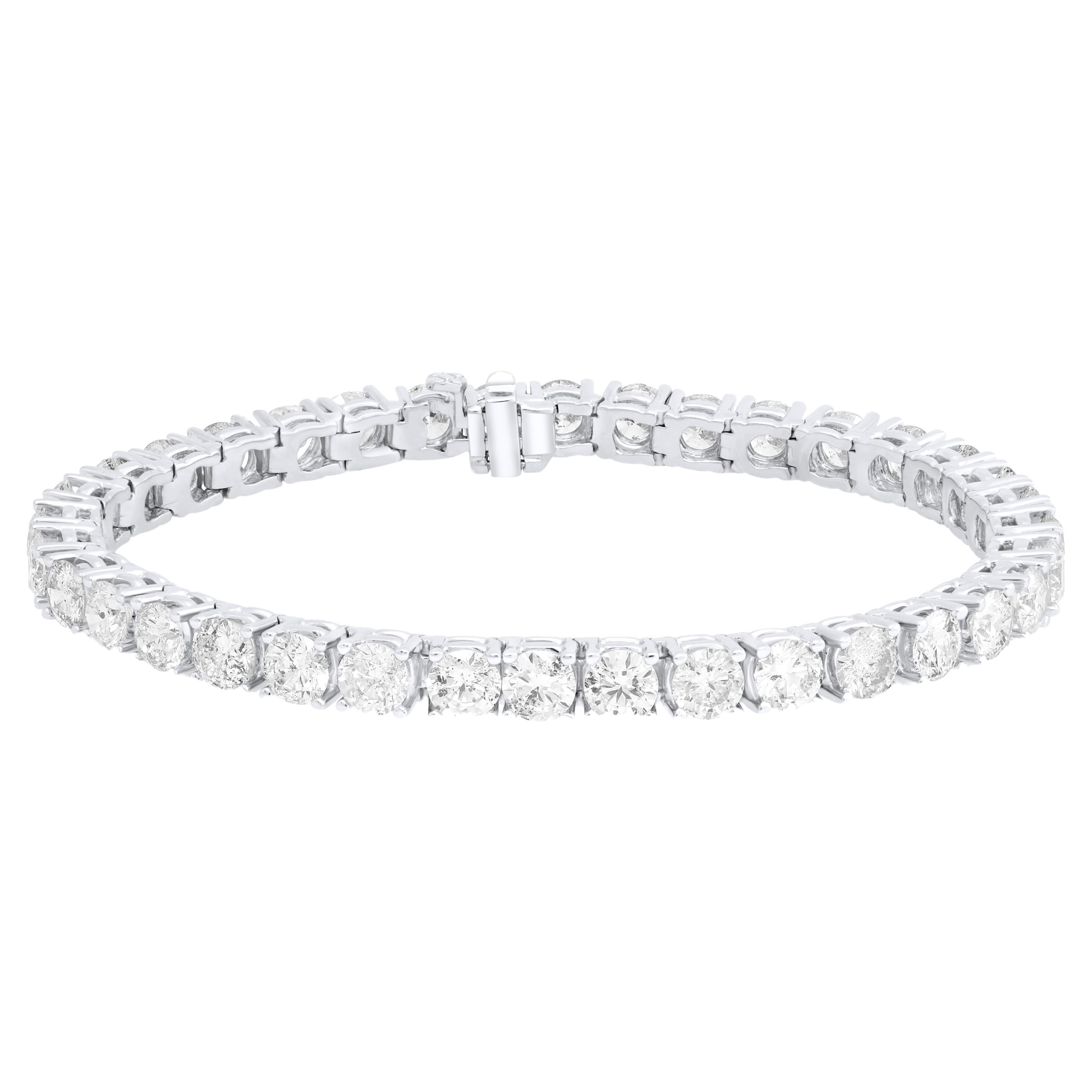 Diana M.18 kt white gold 4 prong diamond tennis bracelet adorned with 12.01 cts  For Sale